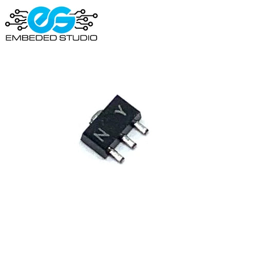 A small black surface-mount electronic component (2SA1213 SOT-89 transistor) showing the "NY" marking on its body and featuring three silver metal pins, set against a plain white background with the Embeded Studio logo watermark in the top-left corner.