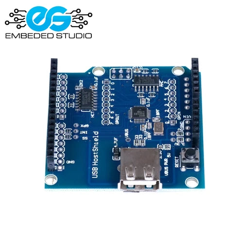 Blue MAX3421E USB Host Shield expansion board for Arduino featuring an onboard USB Type-A female port, printed circuit traces, and male header pins, with the Embeded Studio logo on a clean white background