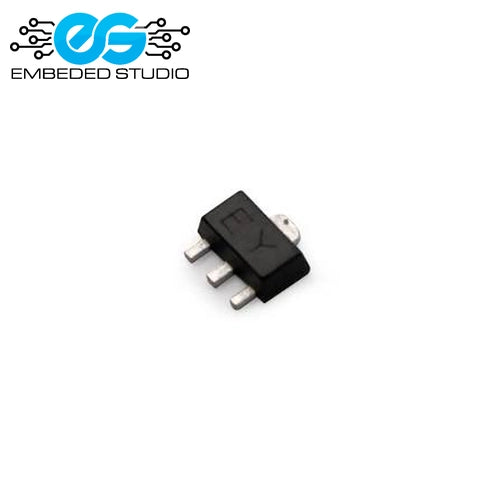 A small black surface-mount electronic component (2SC2655 SOT89 transistor) displaying the "EY" marking on its body, featuring three silver metal pins and set against a plain white background with the Embeded Studio logo watermark in the top-left corner.