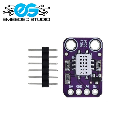 A purple electronic sensor module with a central multi-pin connector, labeled 'MICS524' and '5V GND A0 I2C', shown next to six silver metal pins with a black connector tab on a white background. The 'EMBEDDED STUDIO' logo is in the top-left corner.
