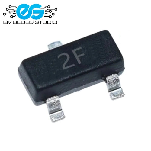 An MMBT2907 PNP switching transistor in a black SOT-23 surface-mount package. The top face is marked with the text "2F", and its three silver metal leads rest against a solid white background. The blue "Embeded Studio" company logo is visible in the upper-left corner.