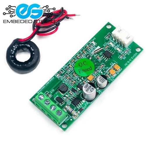 PZEM-004T 100A AC voltmeter module board shown at an angle next to its black current transformer (CT) coil with red and black wires, featuring the Embeded Studio logo.
