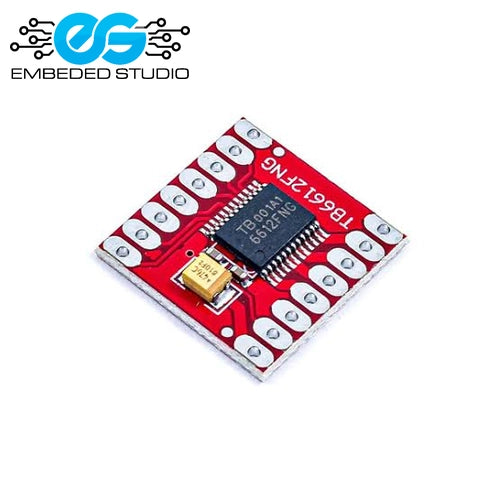TB6612FNG module featuring a red PCB with a black 16-pin microcontroller, a small gold capacitor, and white cylindrical components, shown on a white background with the 'Embedded Studio' logo in the top-left corner.