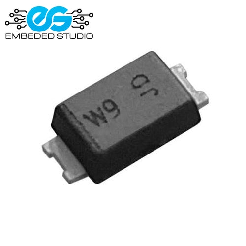 A small black surface-mount electronic component (W9 SOD-123 zener diode) displaying the printed markings "W9" and "JD" on its top surface, featuring two silver metal leads on either side, set against a plain white background with the Embeded Studio logo watermark in the top-left corner.